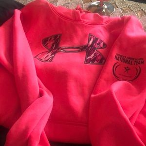 Medium, Pink Under Armour hoodie with camo decal.